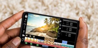 How to Create a Powerful Video Editing App: Step-by-Step Tutorial person using video editing app on smartphone at beach