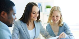 Enhancing Client Relationships with Advanced Accounting Reports three accountants working on accounting reports