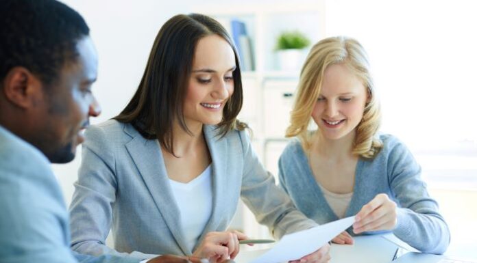 Enhancing Client Relationships with Advanced Accounting Reports three accountants working on accounting reports