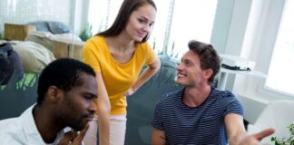 Top Tools for Seamless Cross-Functional Team Communication a cross-functional team of three people using a computer