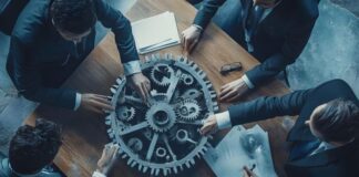 Generative AI Tool and Its Role in Improving Business Operations team around large gear on table improving business operations