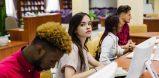 Online vs. In-Person Education: Which Model is Best for Students students in front of computers at in-person education setting