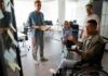 The Business Case for Accessibility: Why Inclusive Design Matters workers in office with inclusive design