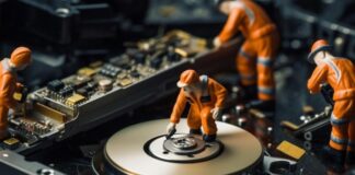 Comprehensive Product Review: Stellar Repair for MS SQL product review of database repair, shown with repair workers on computer components