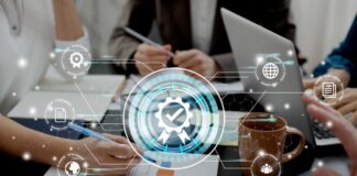 Understanding Test Cases vs. Test Scenarios software developers at desk understanding test cases with tech graphic overlay