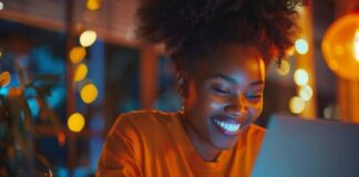 Adblock Chrome Extension: Ultimate Guide to Ad-Free Browsing Experience happy woman on laptop using ad-free browsing