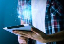 One Bad Google Review Tanked Their Sales – Here’s How They Fixed It business owner dealing with a bad Google review on tablet