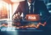 Revolutionizing Risk Management: Business Intelligence and Analytics Risk manager using business intelligence at desk with orange graph and word "risk"