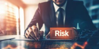 Revolutionizing Risk Management: Business Intelligence and Analytics Risk manager using business intelligence at desk with orange graph and word "risk"