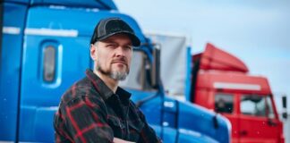 Faster Policy Issuance: Technology Transforms Commercial Auto Insurance man in front of truck fleet, for commercial auto insurance