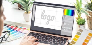 Refined Rebranding: How To Create A Better Logo For Your Business designer on his laptop working to create a better logo