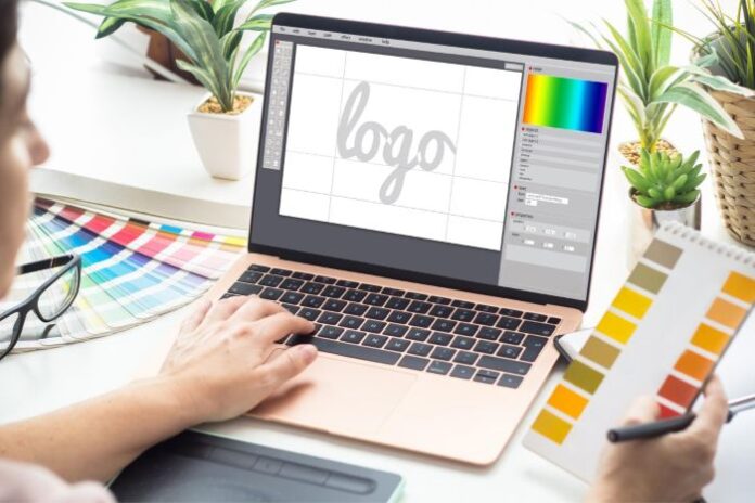 designer on his laptop working to create a better logo