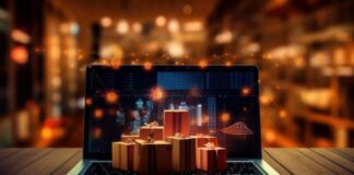 Boost E-Commerce Success with Marketing Revenue Attribution e-commerce success shown with laptop covered by little gold gift boxes