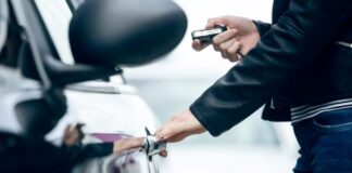 What Features to Look for in Your First Car: Safety, Comfort, and Tech woman opening door on her first car