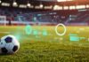 How Technology is Changing the Way We Track Football Scores Football scores in graphic over football field with ball in foreground