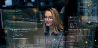 React vs. Vue: Choosing the Right Frontend Framework in 2025 React Vs. Vue frontend framework, with woman programmer on desktop computers