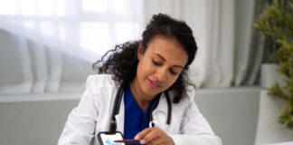 Top Healthcare Mobile App Trends You Should Consider in 2025 doctor using a healthcare mobile app with a patient