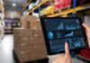 Boost Retail Efficiency with Trade Promotion Management Software retail efficiency shown in warehouse with tablet and graphs