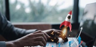 Fuel Your Startup Growth by Investing in Employee Retention Strategies startup growth shown with man on laptop with rocket graph in foreground