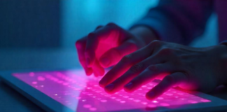 Breaking Barriers: The Future of Tactile Tech for the Visually Impaired tactile tech on tablet with raised Braille, hands reading it