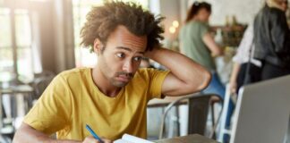 Is EssayHub the Best Assignment Writing Service? A Honest Review College student working on writing assignment at desk with laptop