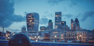 UK Sponsor Licence for Tech Companies: When Do Owners Need It? Tech companies may need UK sponsor licence, shown with city scape at night