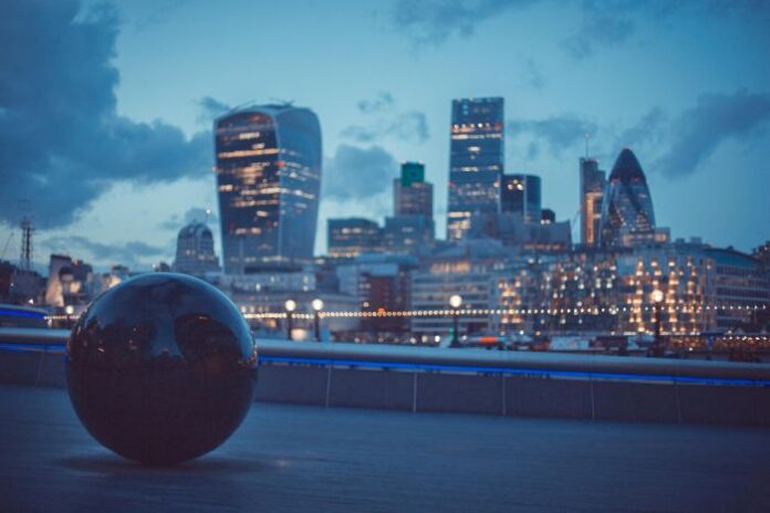 Tech companies may need UK sponsor licence, shown with city scape at night