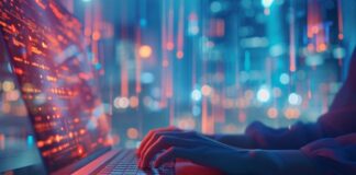 Why Data Science is the Key to Business Growth data science is the key to business, shown with person on laptop at night with lights in the background