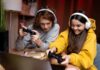 Why Gift Cards Are a Top Choice for Parents Buying Games for Kids teens playing games for kids, with headsets and controllers