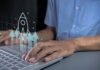 How Startups Can Grow Quickly in 2025 startups can grow quickly in 2025, shown with man on laptop with graphic rocket in foreground