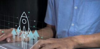 How Startups Can Grow Quickly in 2025 startups can grow quickly in 2025, shown with man on laptop with graphic rocket in foreground