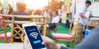 Analyzing the Market: The Growing Demand for Guest WiFi Solutions customer using guest WiFi at a cafe