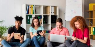 High Admission Rate Colleges: What You Should Know students at a high-admission college working together on devices
