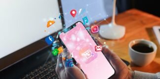 How to Boost Your Social Media Engagement in 2025 hands holding smartphone with social media engagement icons