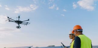 The Evolution of AI-Powered Drones in Solar Energy Management technician doing solar energy management with drone and panels
