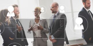 How Global Workforce Management Is Shaping Talent Acquisition team of workforce management discussing talent acquisition in boardroom