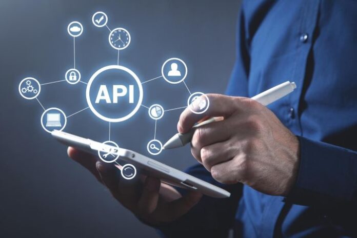 API automation with person on tablet and icons in foreground