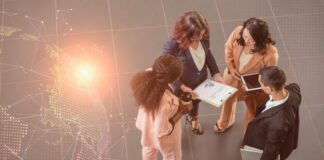 Scaling International Teams: Hidden HR Challenges & How to Solve Them HR challenges like international teams, shown with group of people on tablet with globe in foreground