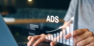 Are Blockchain Ads More Effective than Popunder Ads? blockchain ads or popunder ads, shown with bar graph in foreground over man on laptop