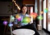 How AI Is Transforming the Future of Digital Marketing the future of digital marketing, with woman on laptop and marketing icons in foreground