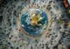The Real Cost of Going Global: What Businesses Overlook businesses going global, shown with overhead shot of globe, with people