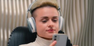 Ofer Tirosh’s Vision: Scalable, Secure, and Cost-Efficient AI woman using cost-efficient AI on her phone for language translation services