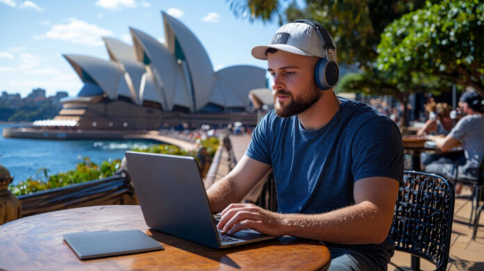 digital marketing with the right agency, shown with man on laptop in front of opera house