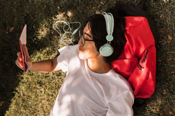 AI is shaping the future, shown with boy watching tablet wearing headphones