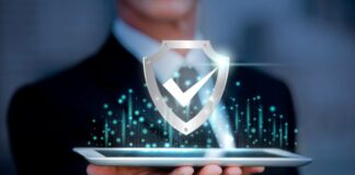 Can AI Detectors Protect Your Business from Deepfakes and Fake Data? AI detectors shown with man with tablet