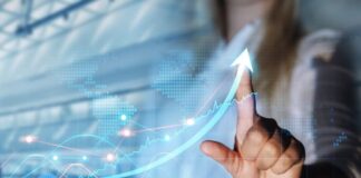 Optimizing Business Processes for Accelerated Growth and Profitability business with accelerated growth, with owner showing upwards graph