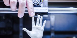 CNC Machining vs. 3D Printing: Which Method is Better for Prototyping? is 3D printing better for prototyping, shown with 3d hand