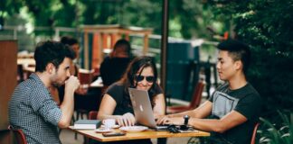 How Crypto Startups Use Competitor Website Data to Outrank the Giants Crypto startup using competitor website data, with three people at a desk