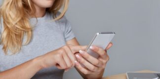 Fax Apps Bridging the Gap Between Traditional and Digital Communication woman using digital communication to send a fax