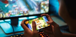 Play Games, Get Paid: Earn Real Cash Testing Apps with Tester Buddy boy playing esports games on a handheld device